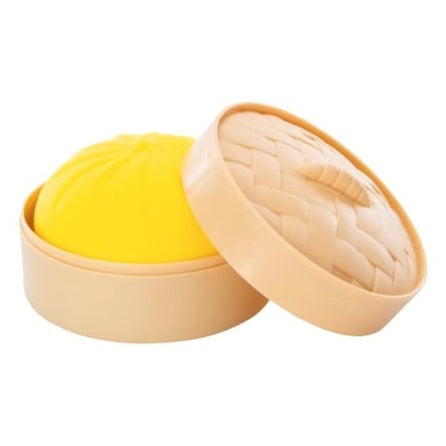 Toy dim sum container with yellow bun.