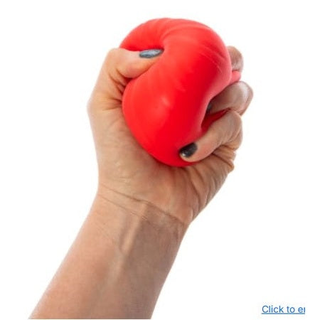 A hand squeezing a red stress ball.