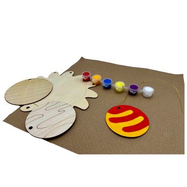 Unpainted wooden sun craft with paints, string, and one painted sample, on brown paper.