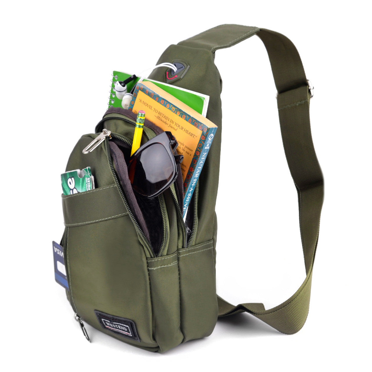 Olive green sling bag with books, sunglasses, gum, and a credit card inside.