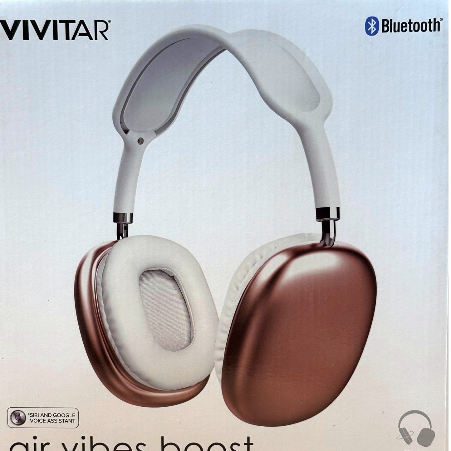 Wireless headphones with a bronze exterior and white interior.