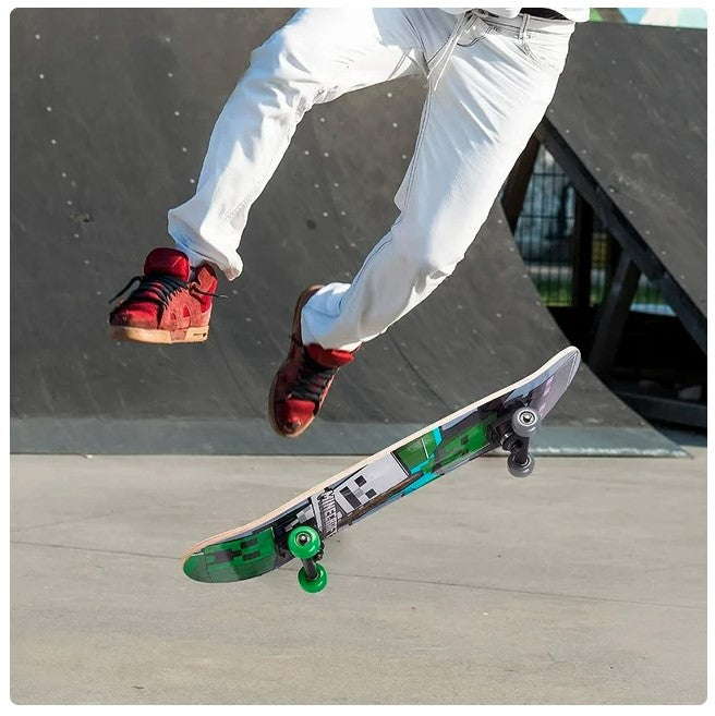 Person doing a skateboard trick wearing white pants and red shoes.