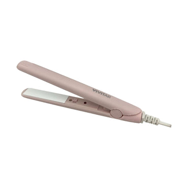 A pink Vivitar hair straightening iron.