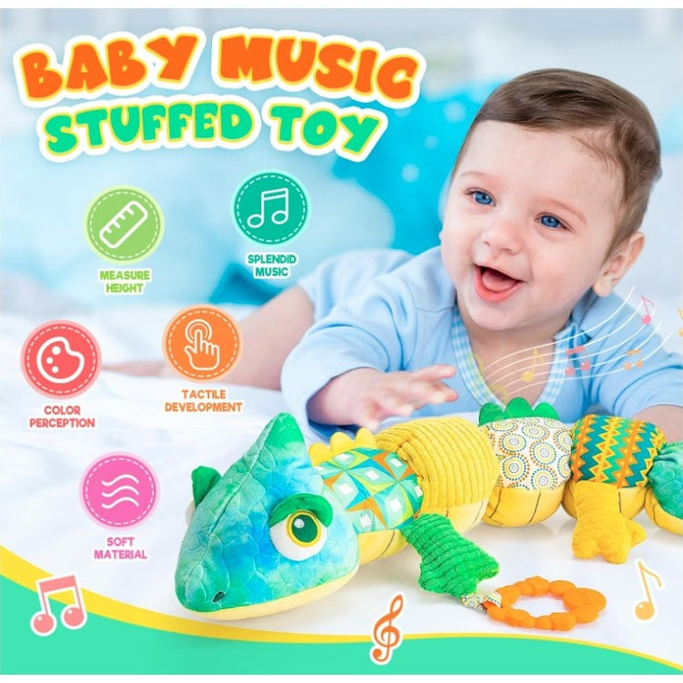 A promotional shot of a smiling baby next to a colorful stuffed lizard toy, which is labeled "Baby Music Stuffed Toy." Logos around the toy emphasize measure height, splendid music, color perception, tactile development, and soft material.