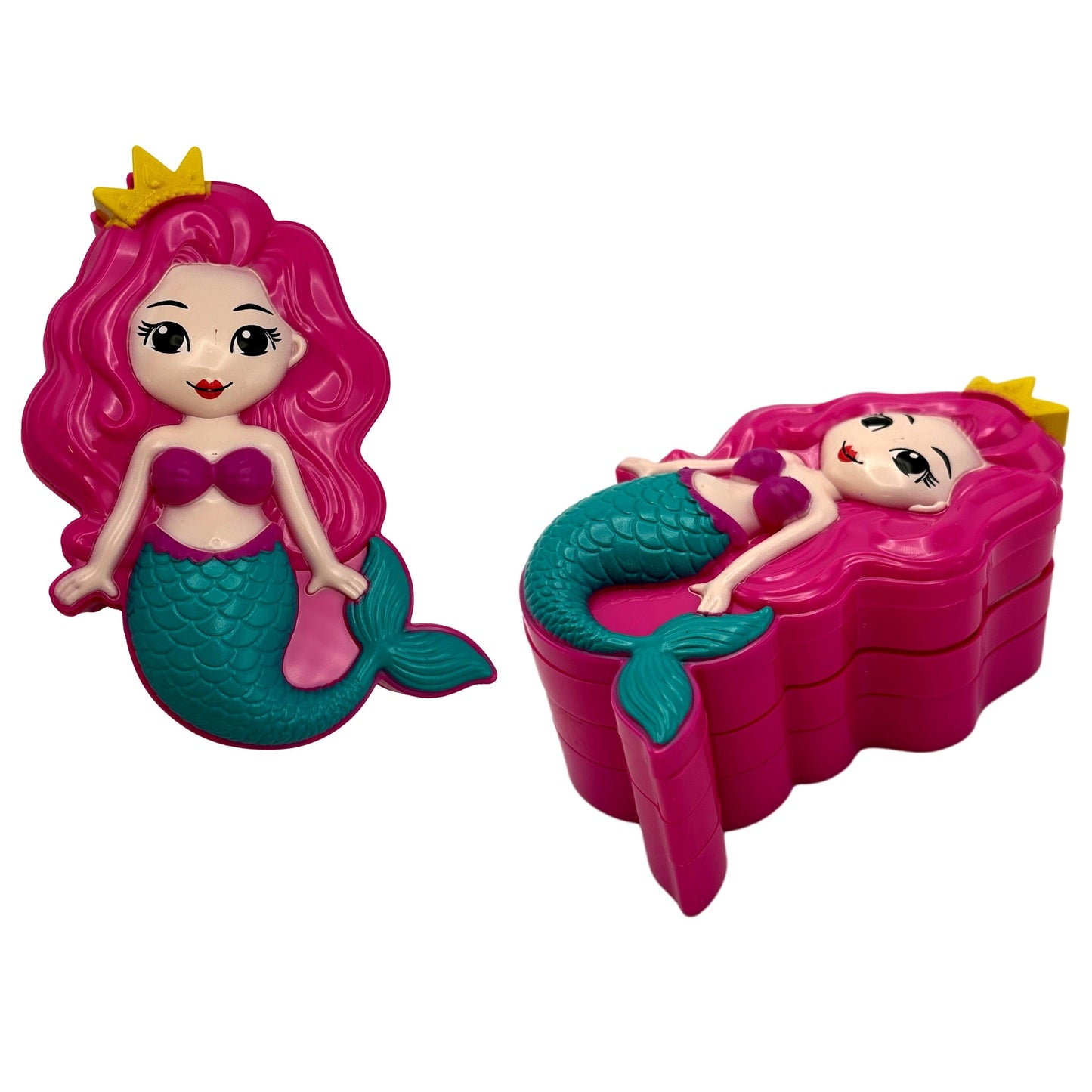 Two toy mermaid figurines. One standing, one lying on a wavy box. Pink hair, yellow crown, purple top, green tail.