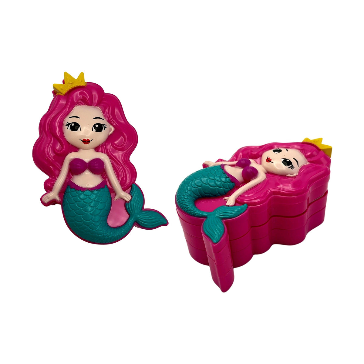 Two toy mermaid figurines. One standing, one lying on a wavy box. Pink hair, yellow crown, purple top, green tail.