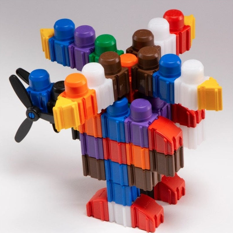 Toy airplane constructed from plastic blocks of various colors.