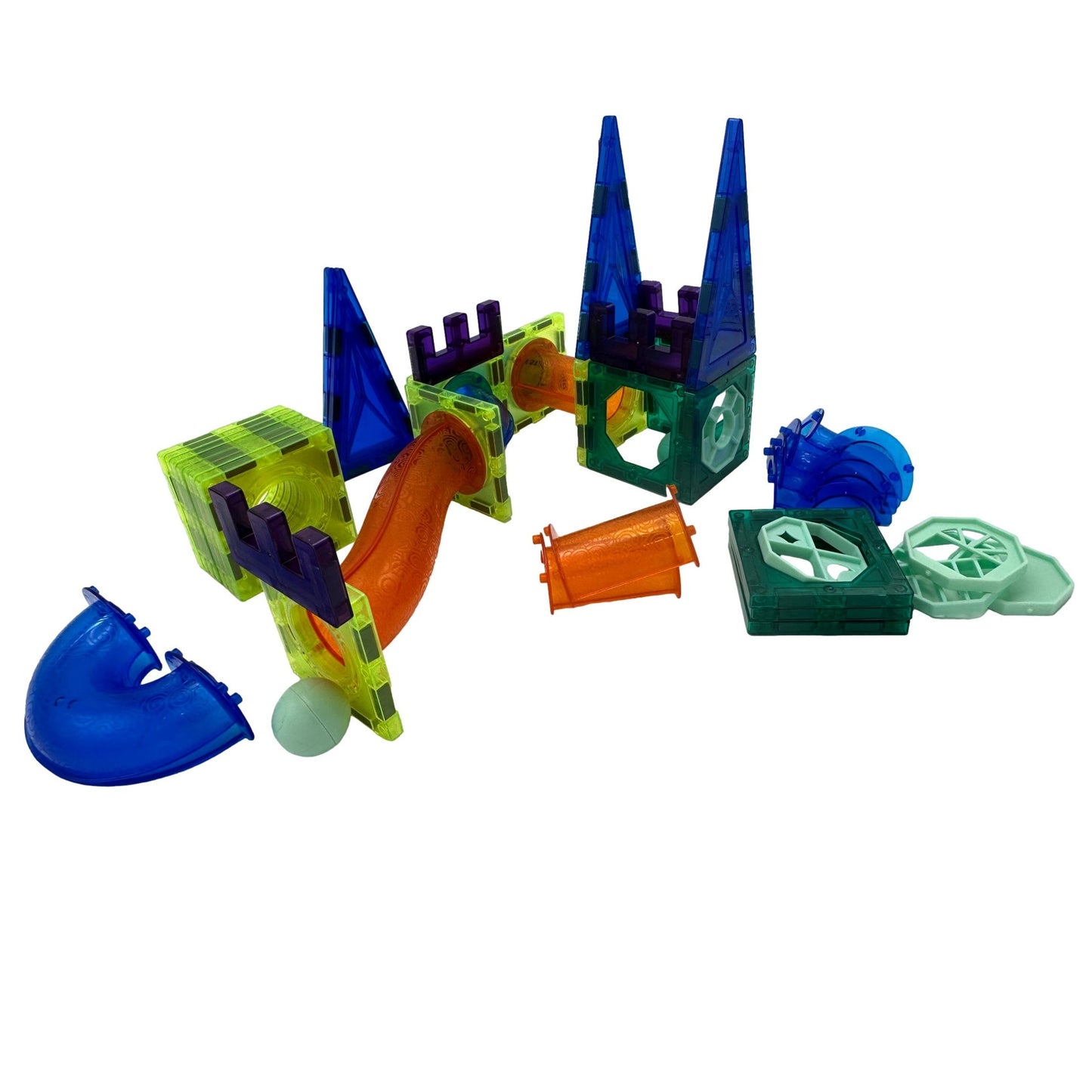 A colorful set of magnetic building blocks arranged on a white surface.