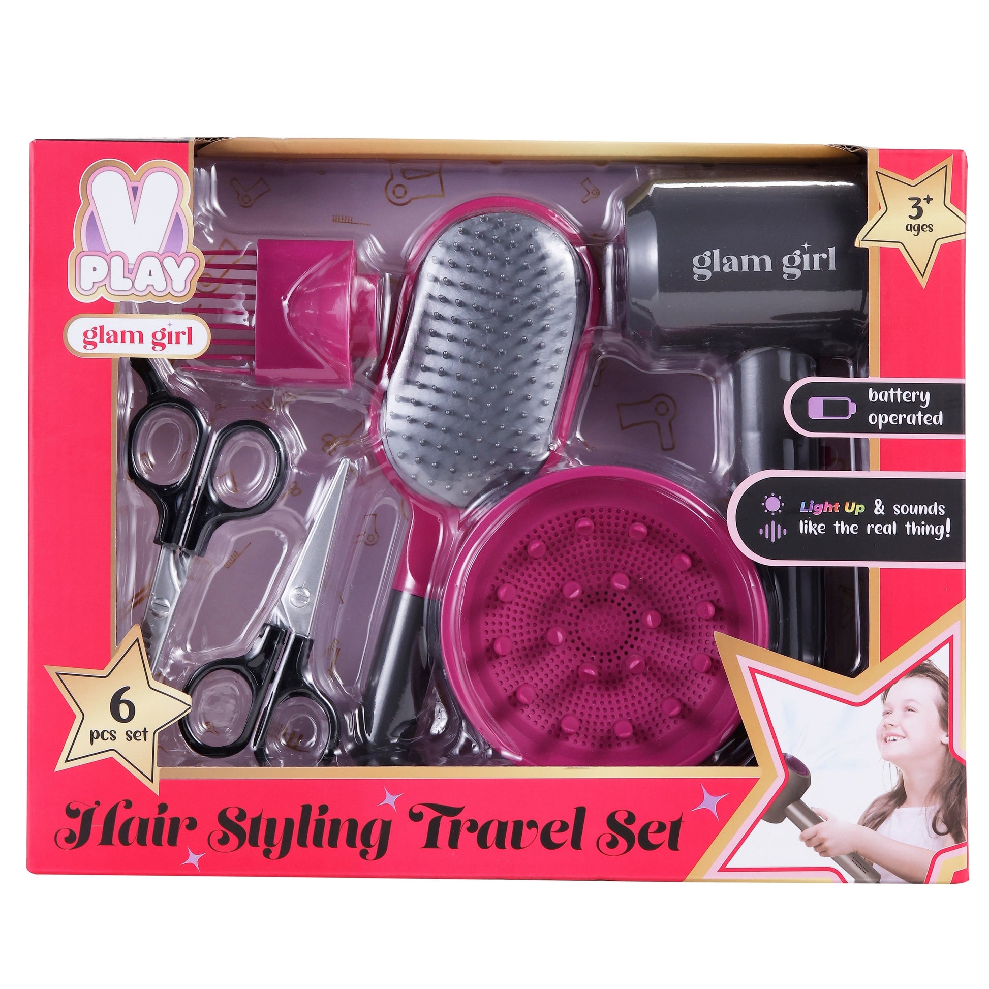A hair styling set in a pink box with a brush, hairdryer, diffuser, and scissors.