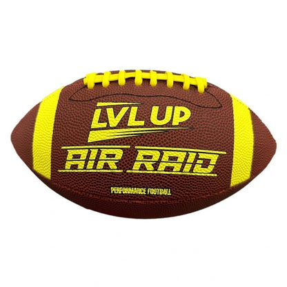 An American football with yellow stripes and laces. It is brown with "LVL UP AIR RAID PERFORMANCE FOOTBALL" written on it in yellow.