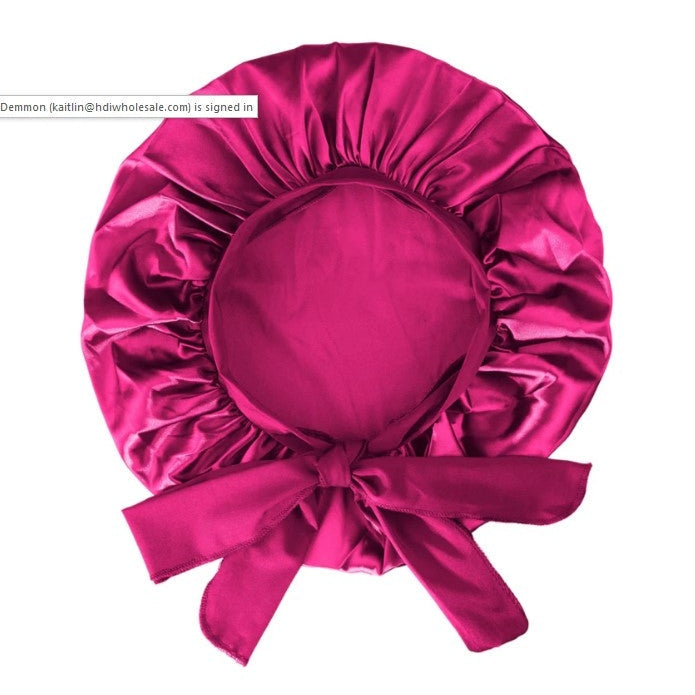 Fuchsia satin hair bonnet with ties.