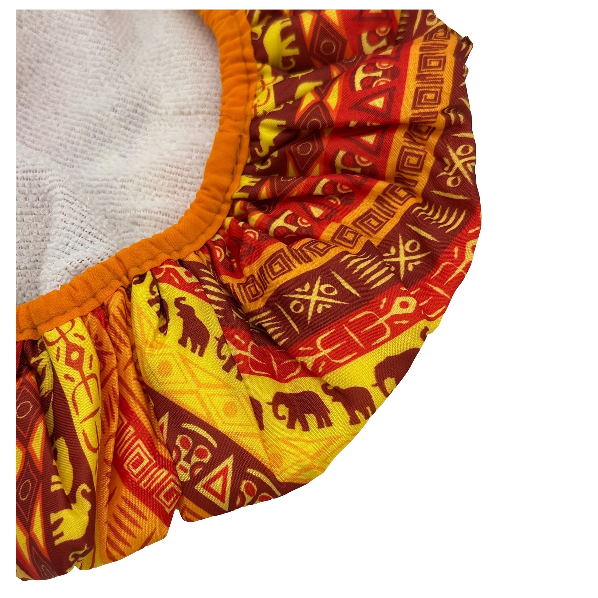Cloth diaper with orange trim and red, brown, and yellow African print.