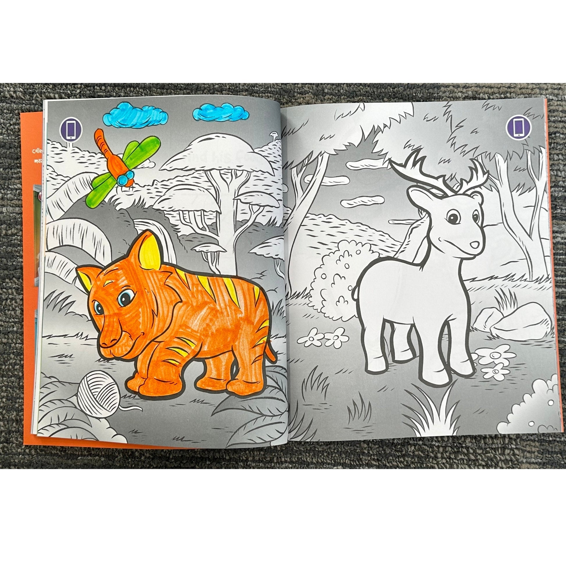 Opened coloring book with a partially colored tiger and a non-colored deer.