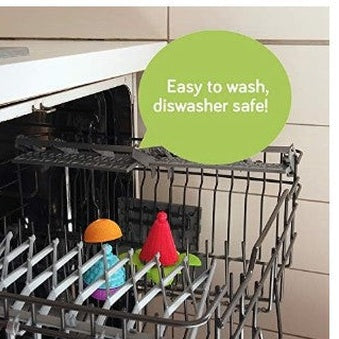 Here are a few alt tag options for the image:

**Concise:**

*   Toy in dishwasher.

**More descriptive:**

*   Colorful toy in dishwasher rack, with green speech bubble "Easy to wash, dishwasher safe!".

I tried to balance accuracy with brevity, emphasizing that the image shows a toy advertised as dishwasher safe.