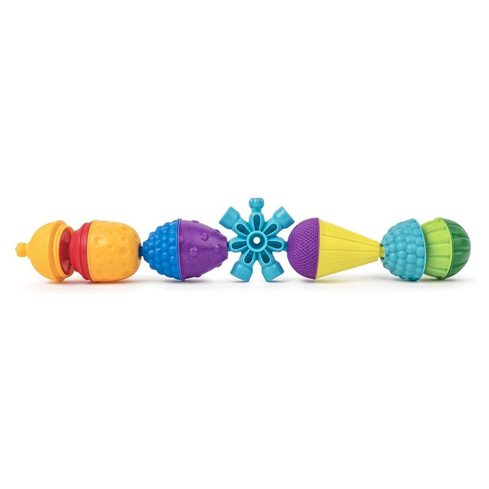 A row of colorful, textured, plastic building blocks.