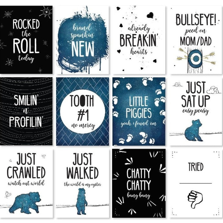 A collection of cards with humorous baby milestones and sayings.