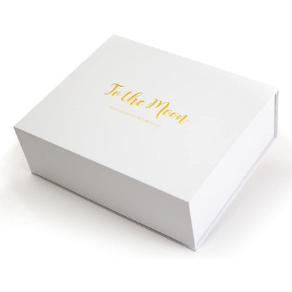 White box with golden lettering "To the Moon".
