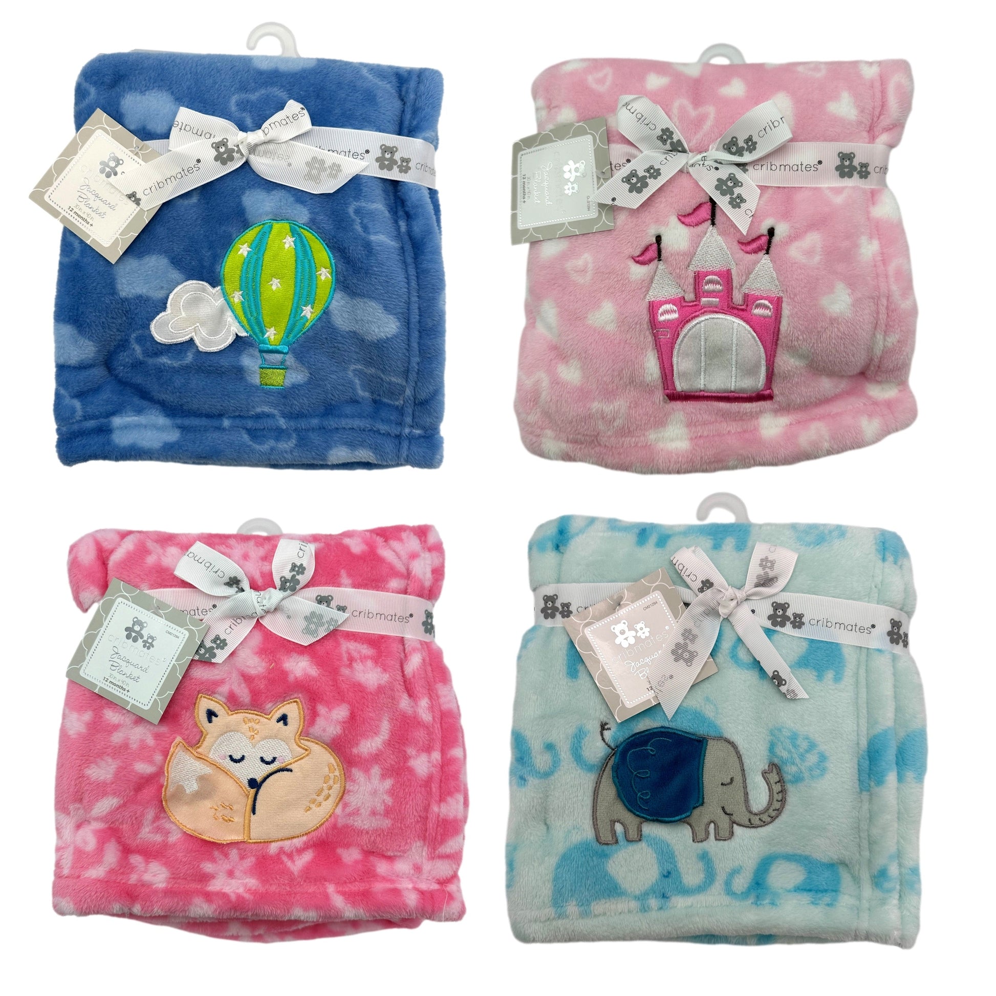 Four baby blankets are displayed against a white background. The blankets are folded and feature different colors and embroidered designs. From top left to bottom right: a blue blanket with a hot air balloon, a pink blanket with a castle, a pink blanket with a sleeping fox, and a light blue blanket with elephants. Each blanket is wrapped with a white ribbon that reads "cribmates," and a tag hangs from the ribbon.