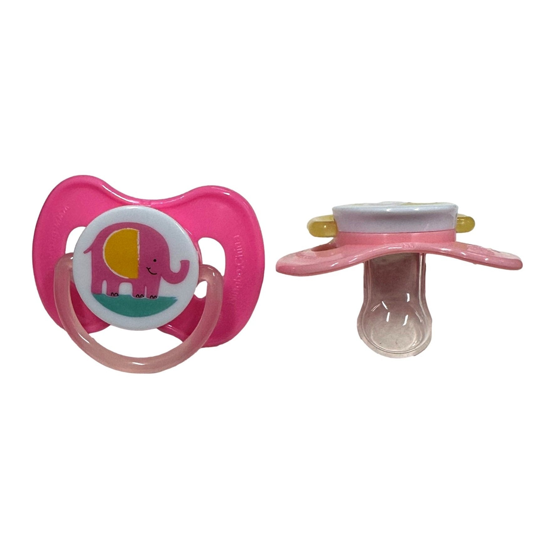 Two baby pacifiers, one pink with an elephant design, the other pink and white.