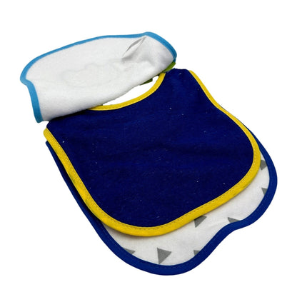 Three bibs, stacked. White, blue, and gray bib on top, dark blue bib with yellow lining in the middle, and gray and white bib with triangle pattern on the bottom.