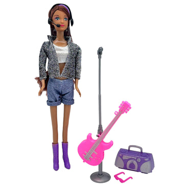 Doll with microphone headset, silver jacket, denim shorts, purple boots, a pink guitar on a stand, a purple boombox, and pink glasses.
