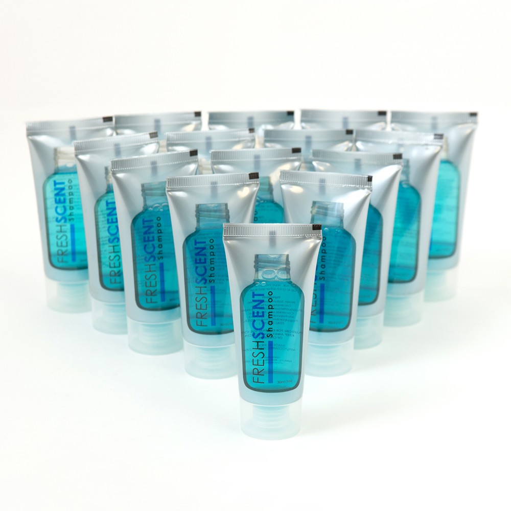 A group of blue and white shampoo tubes arranged in a pyramid shape on a white surface.
