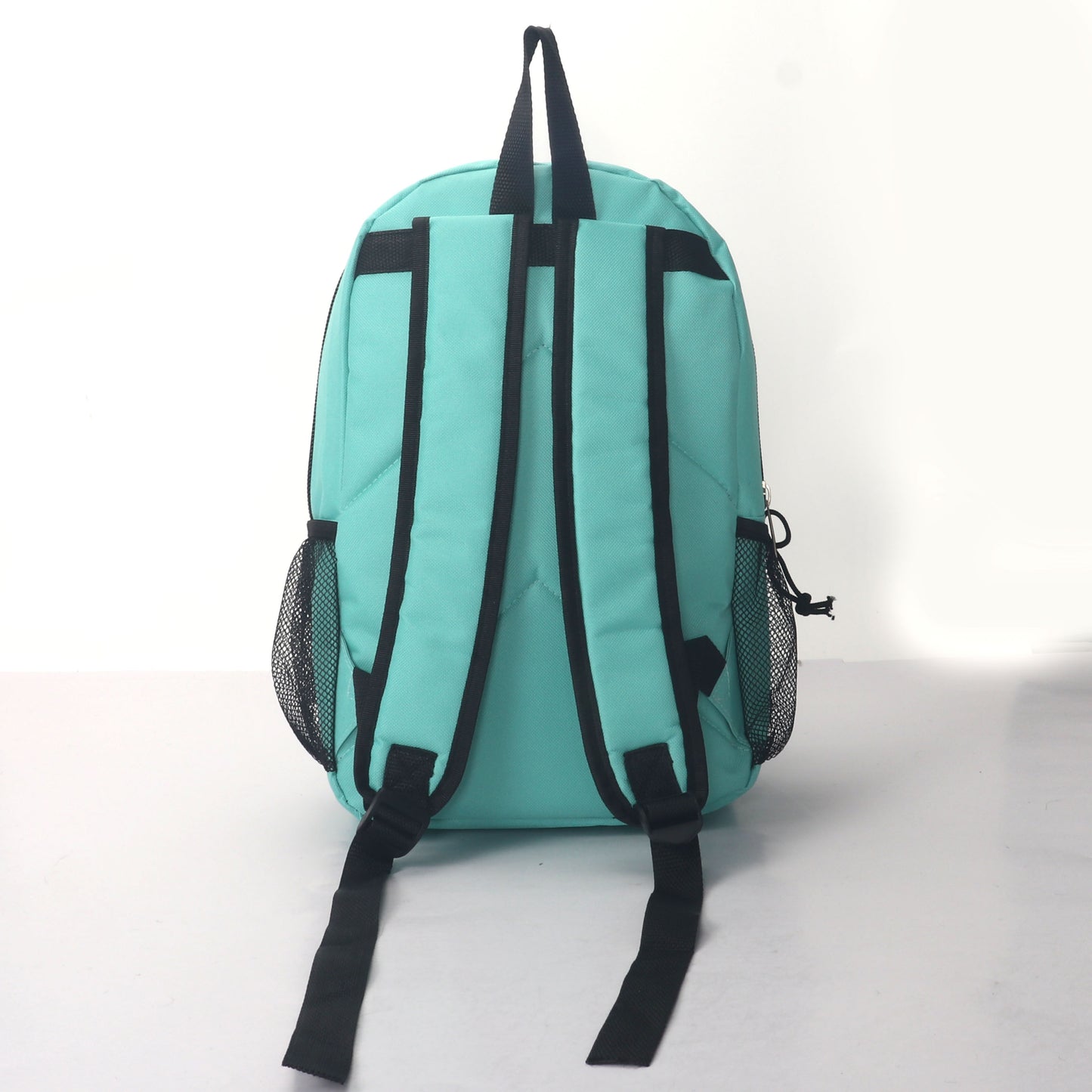 MOCHILA ESCOLAR 15 EN 2 BOLSILLOS LATERALES DE MALLA SURTIDOS