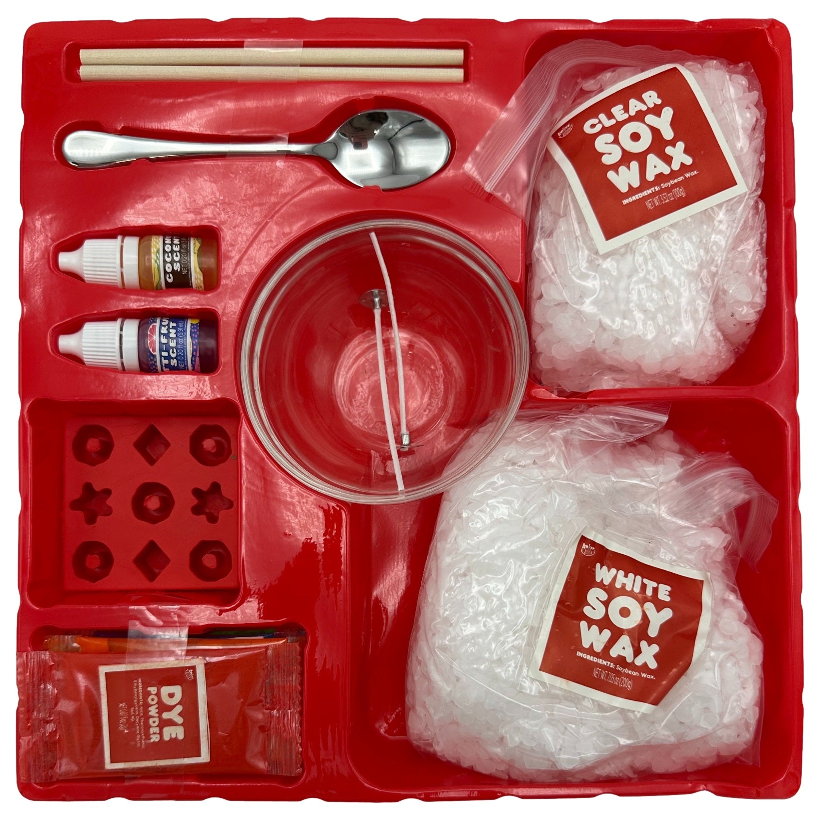 Candle making kit in red tray with two wax types, dye, scents, molds, utensils, and bowl.
