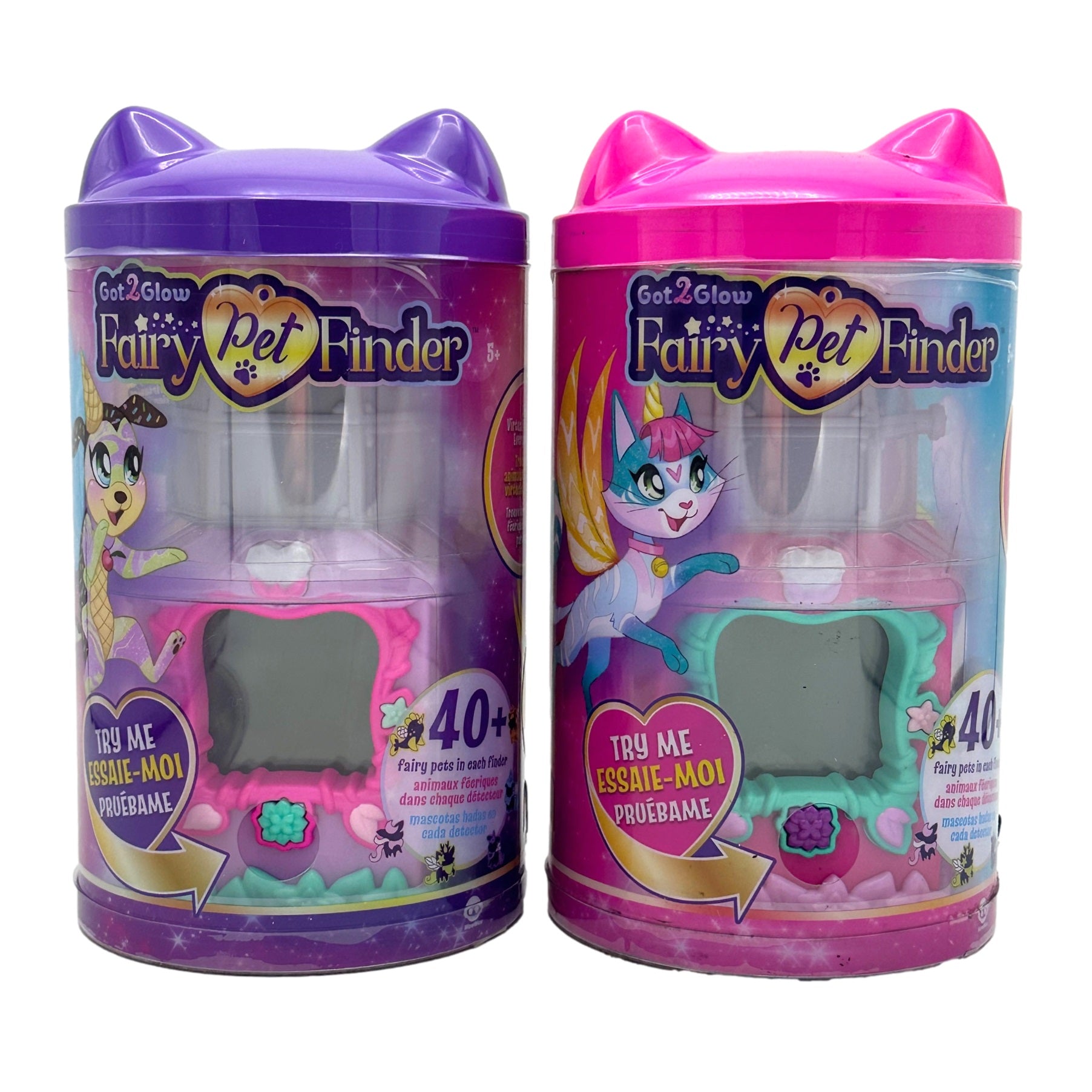 Two "Got2Glow Fairy Pet Finder" toys, one purple and one pink, in clear plastic containers with cat-ear lids.