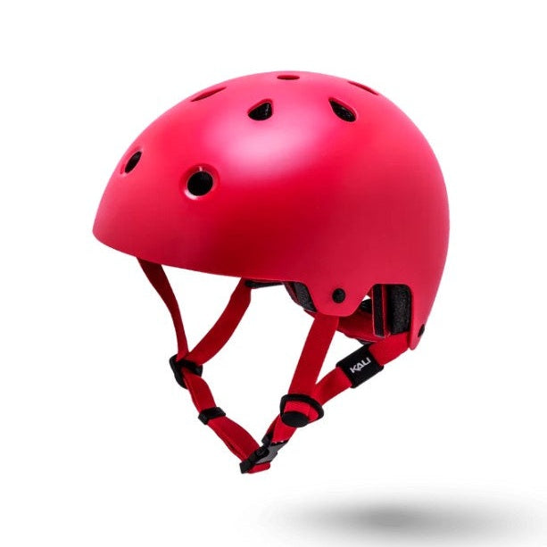Red helmet with black straps and ventilation holes.