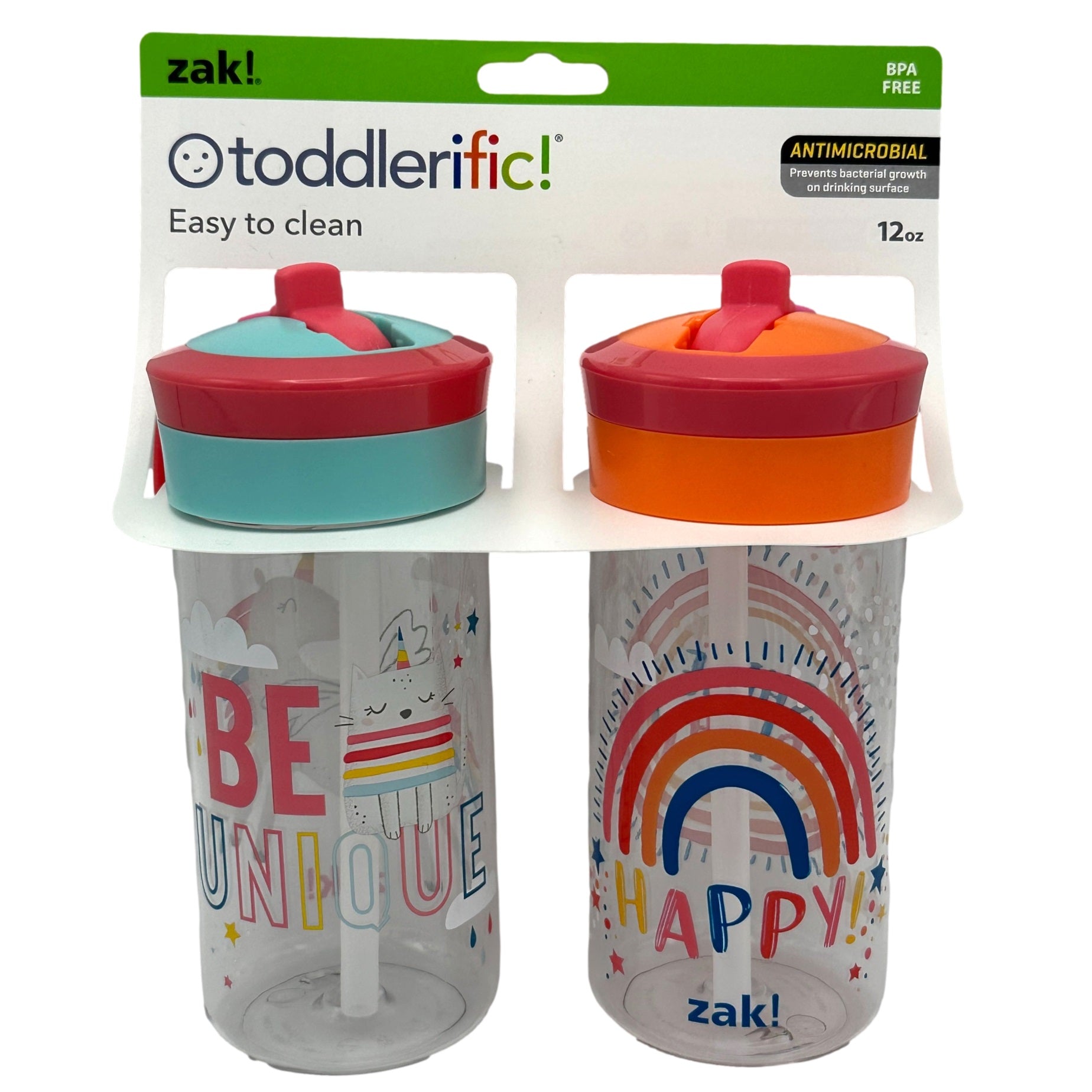 Two Zak! toddlerific! 12oz cups, one with "Be Unique" and a cartoon cat with a unicorn horn, the other with "Happy!" and a rainbow. Both cups have orange and pink lids, and are mounted on a white cardboard display.