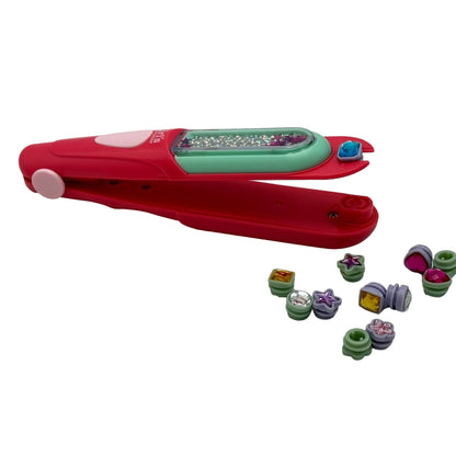 Red toy hair gem applicator with colorful beads.