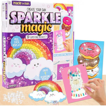 Product shot of a "made by me! Create Your Own Sparkle Magic" 3D gemstone mosaics kit, featuring a rainbow and clouds design, along with examples of completed mosaic cards.