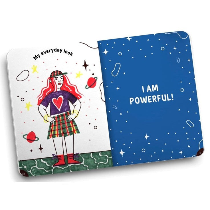 Open journal with colorful illustrations and motivational text.