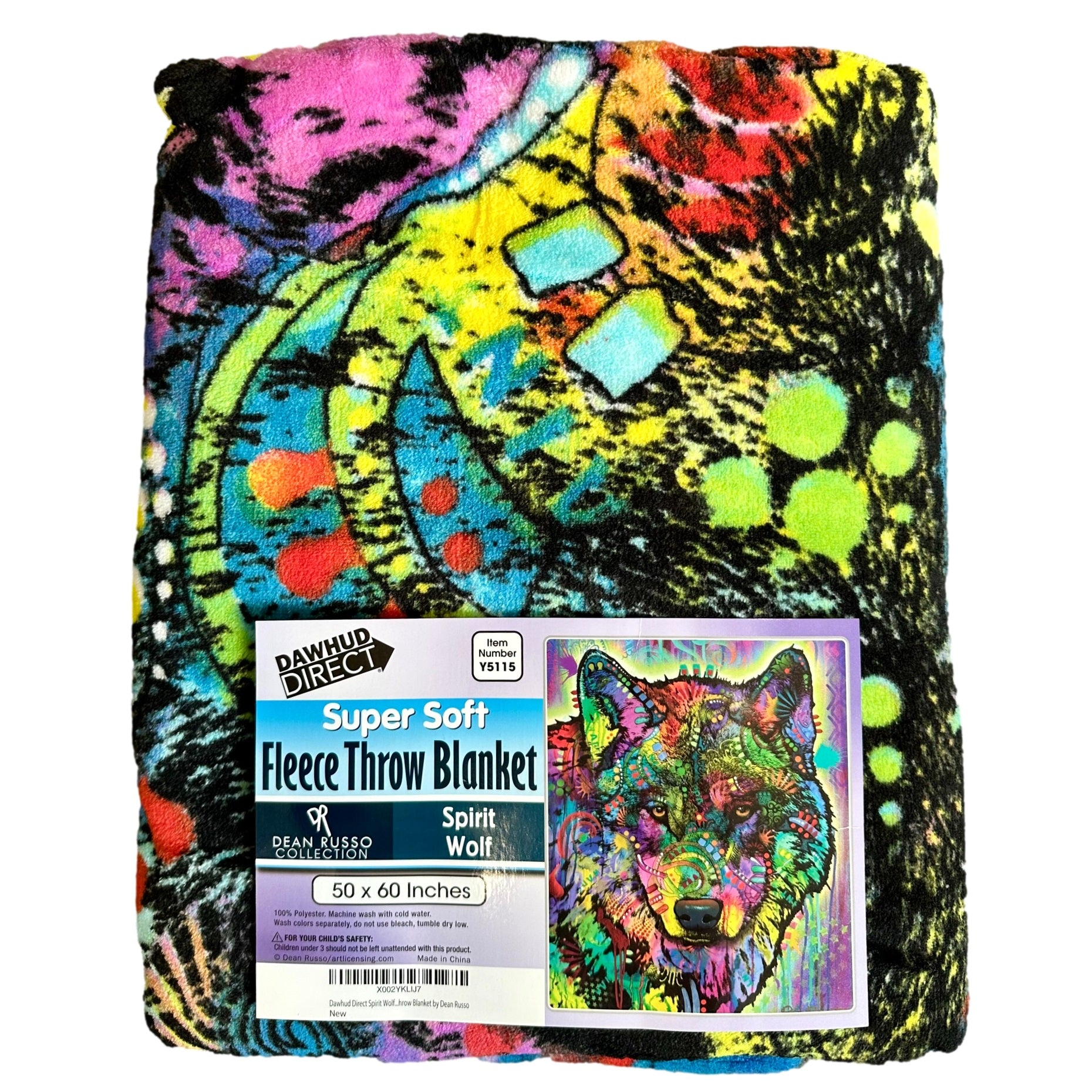 Folded, colorful fleece throw blanket with wolf image.