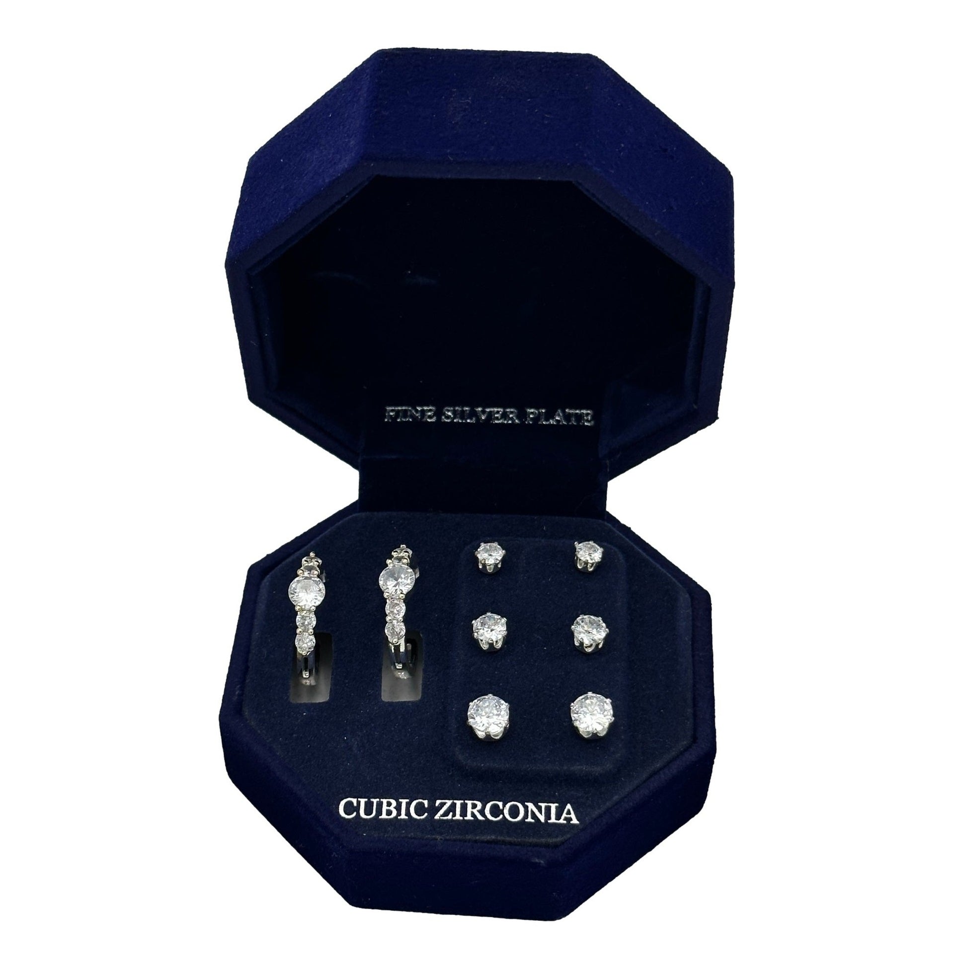 Open, blue velvet jewelry box with silver-plated cubic zirconia earrings.
