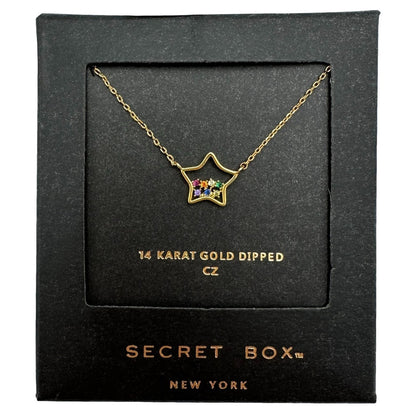 Gold-dipped star necklace with colorful stones in a black box.
