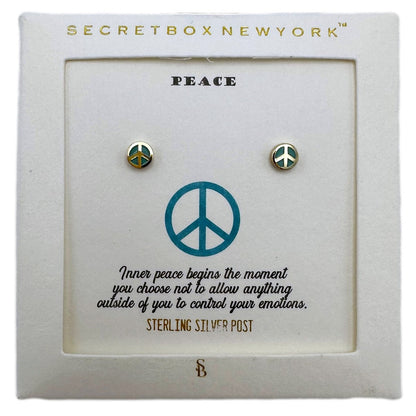 Peace sign earrings on a display card.
