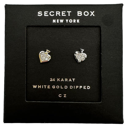 Two silver and CZ heart-shaped earrings in a black display box.