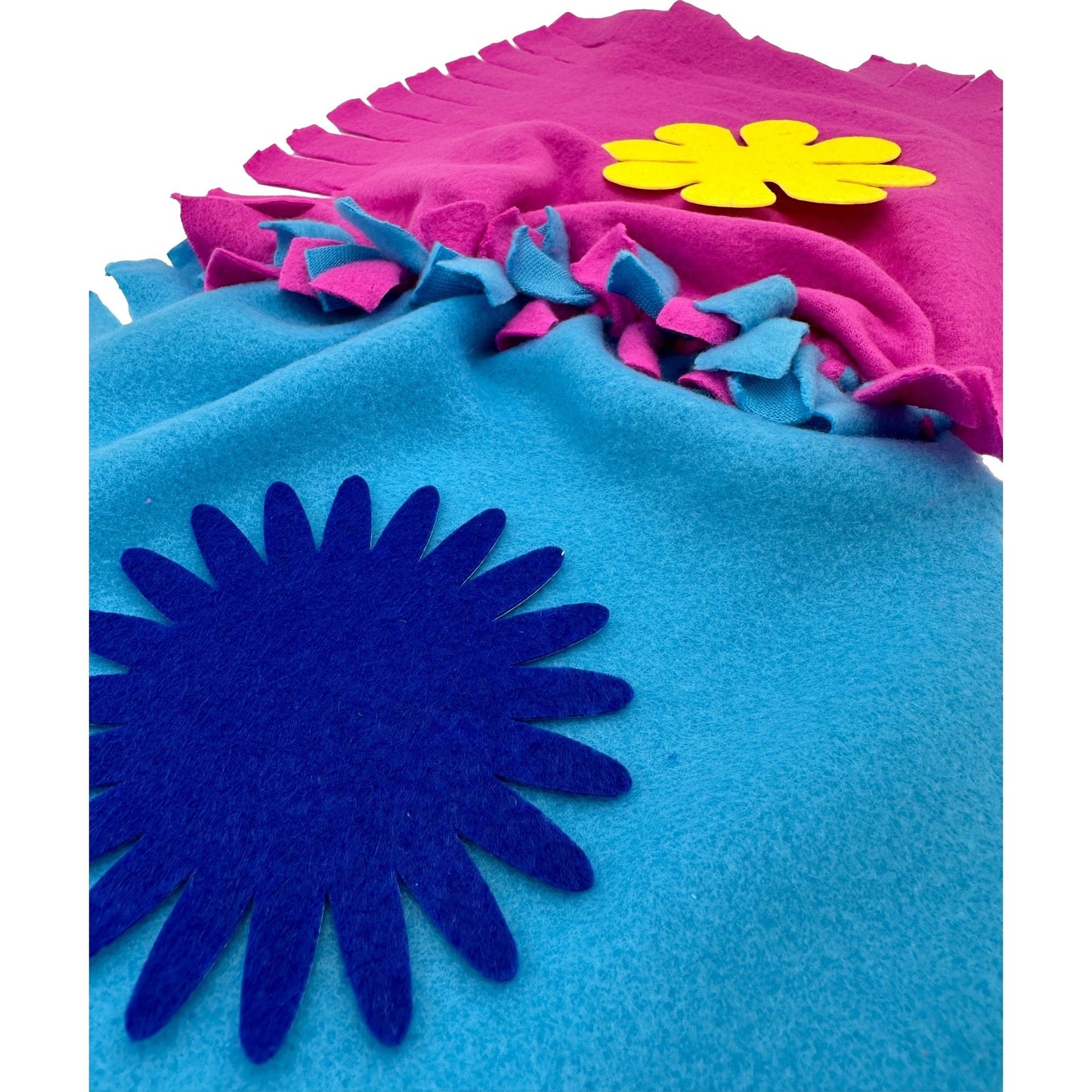 Felt craft project with blue, pink, and yellow felt.