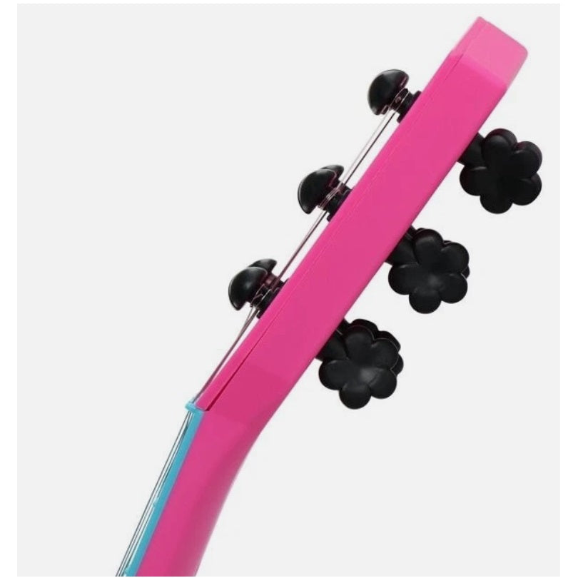 Close up of the headstock of a pink toy ukulele.
