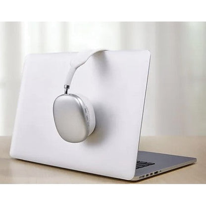 Silver headphones hanging on a laptop.